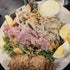 Salad with chicken, eggs, and croutons on a plate