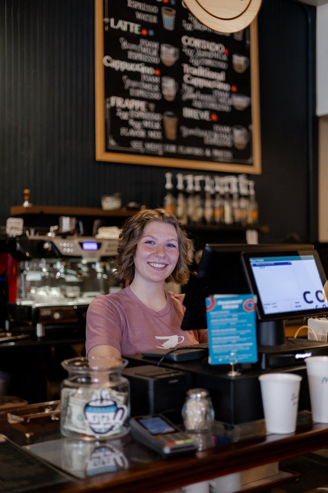 Friendly woman at the register