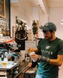 Barista preparing a drink in a coffee shop